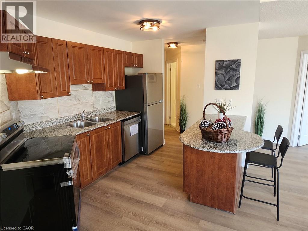 A kitchen with wooden cabinets and a granite countertop.