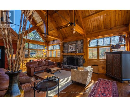 A living room with a vase on a table and a couch.