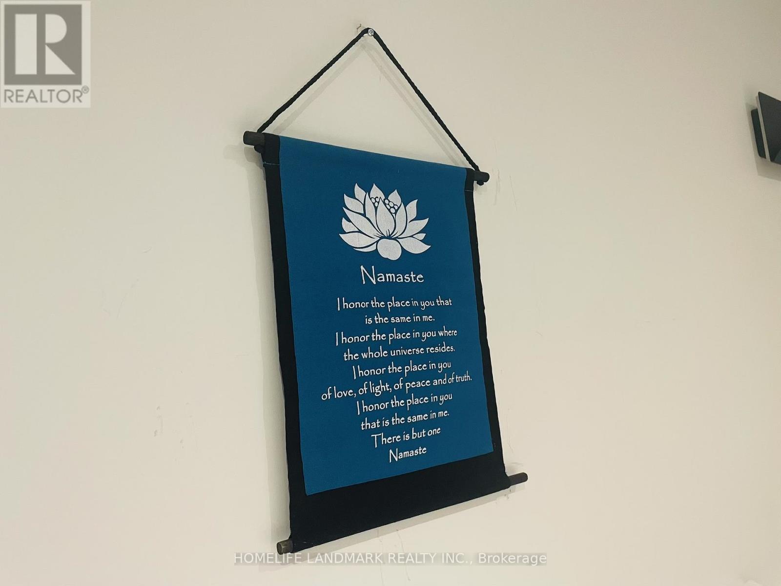 A poster with a lotus flower and the word Namaste on it.