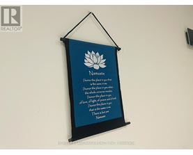 A poster with a lotus flower and the word Namaste on it.