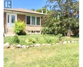 A house with a lawn in front of it.