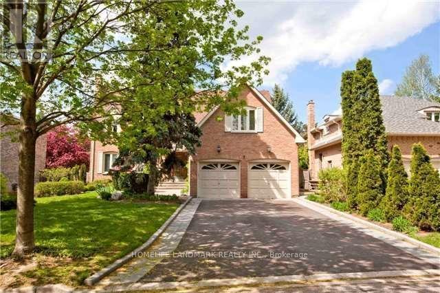 A house with a driveway and garage doors.