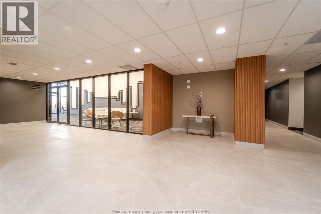 A spacious office room with a desk and chairs.