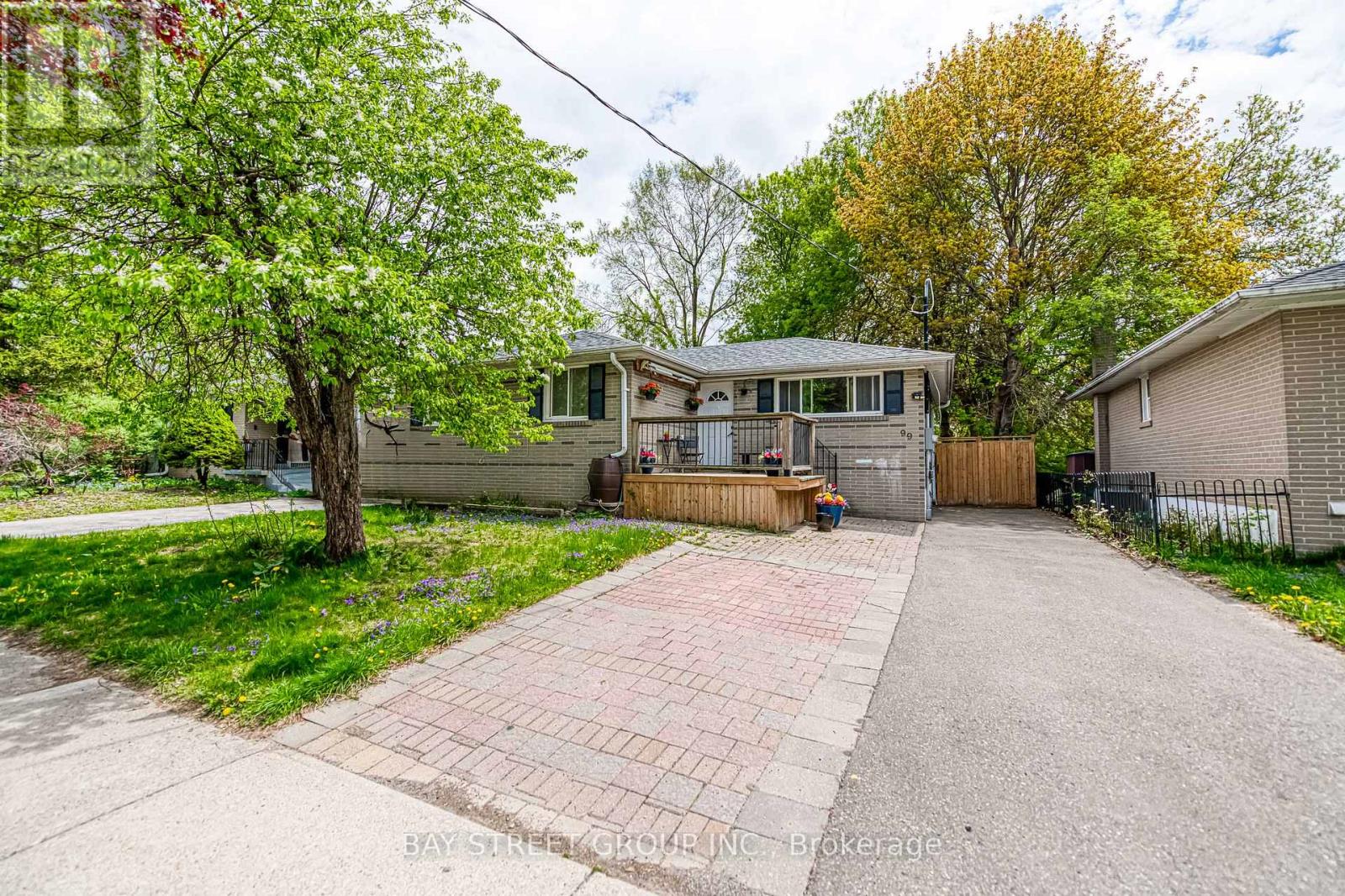 A house with a driveway in front of it is for sale.