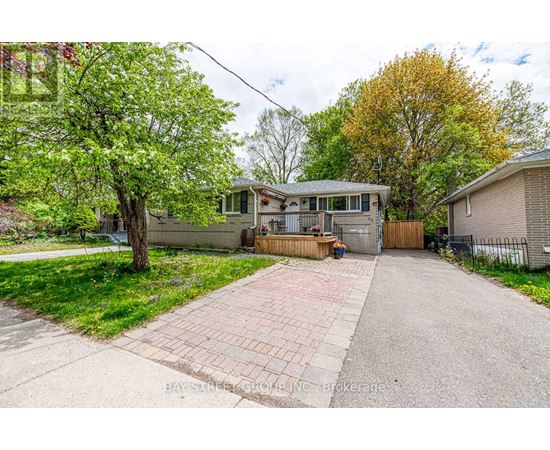 A house with a driveway in front of it is for sale.