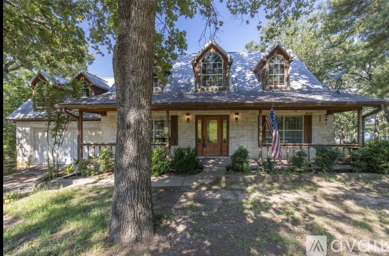 A house with a flag on the front porch.