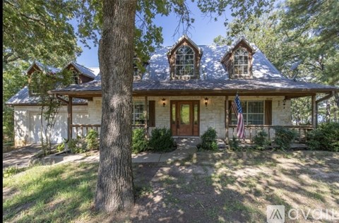 A house with a flag on the front porch.