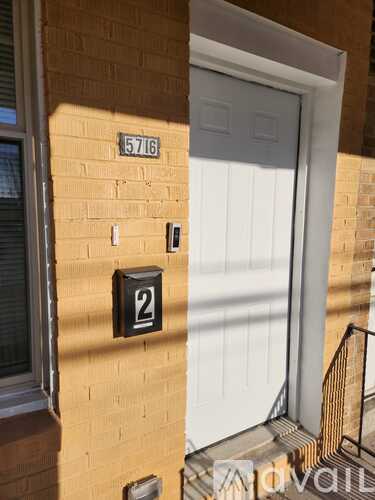 A white door is on the right and a number 2 is on the wall.