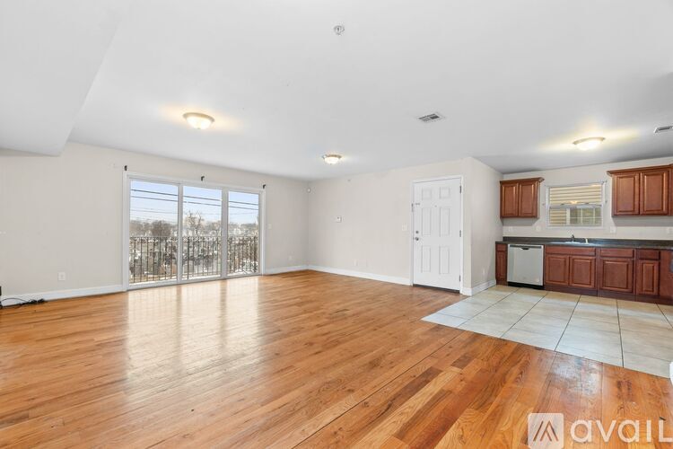 A kitchen with wooden cabinets and a white refrigerator.
