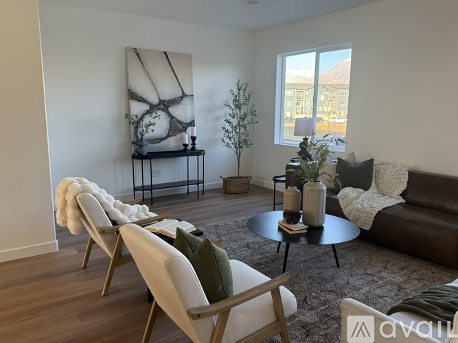 A living room with a row of chairs and a couch.