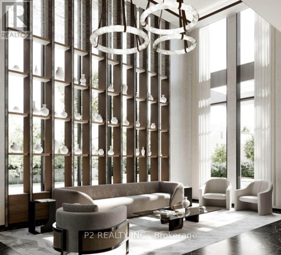 A modern living room with a large window and a chandelier.
