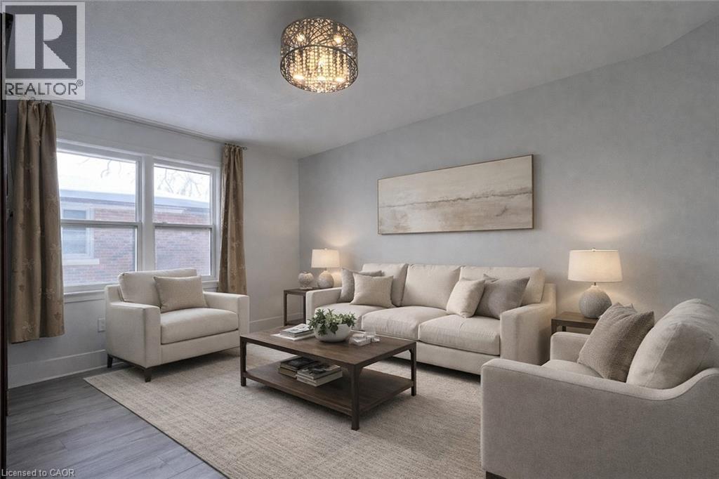 A living room with a large couch, a chair, and a coffee table.