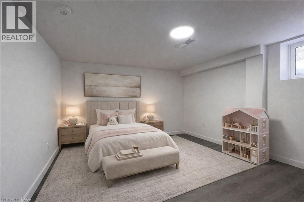 A bedroom with a bed, nightstands, and a dollhouse.