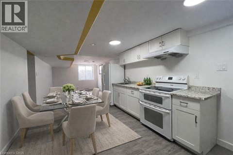 A well-lit kitchen and dining area with modern furniture.