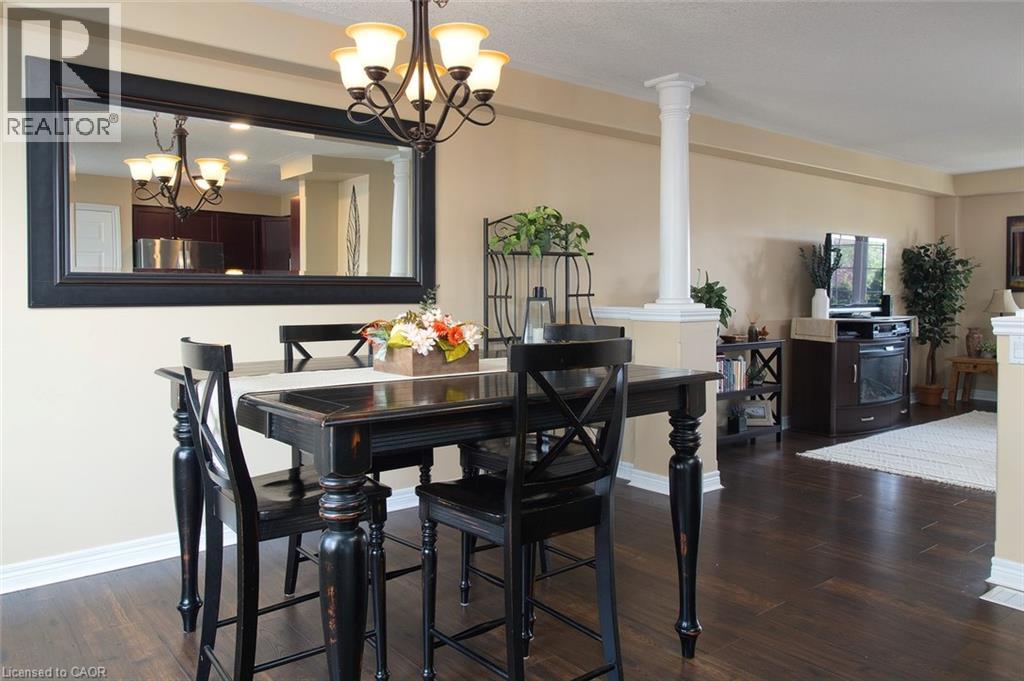 A dining room with a table and chairs.