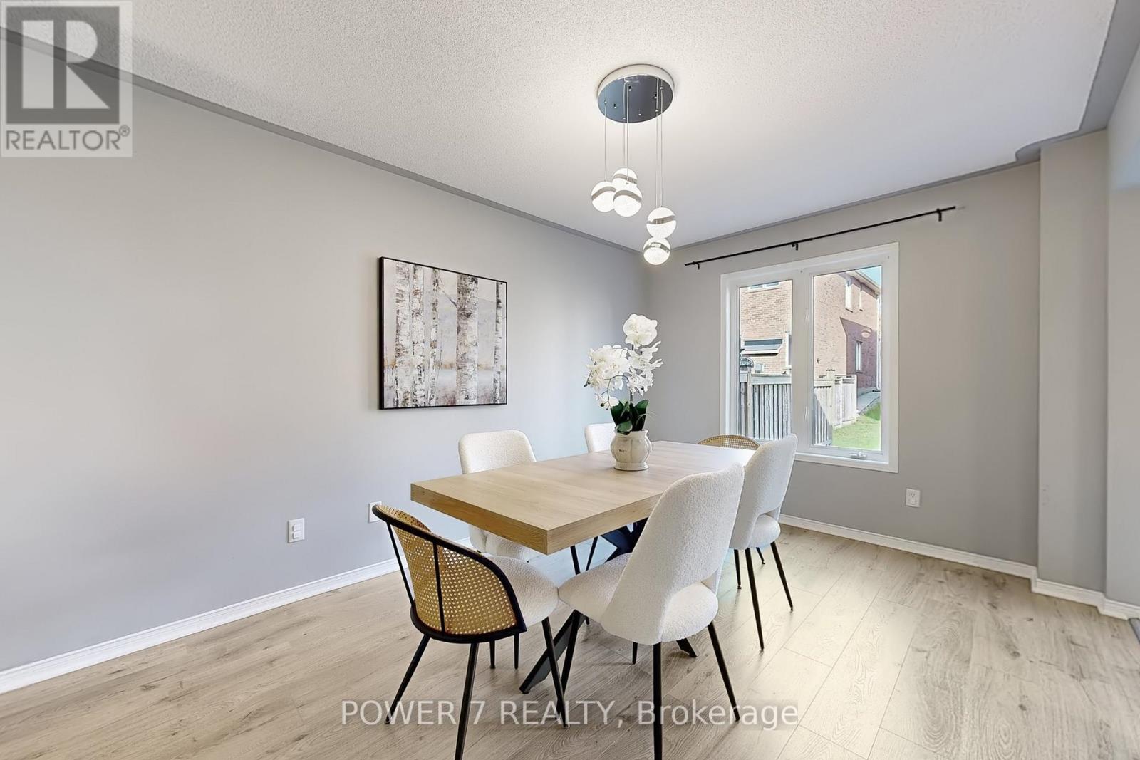 A dining room with a table set for four.