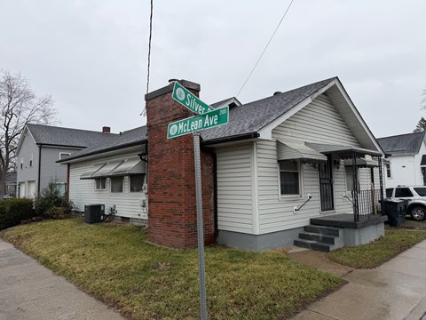 A house with a sign that says "Silver Ave" in front of it.