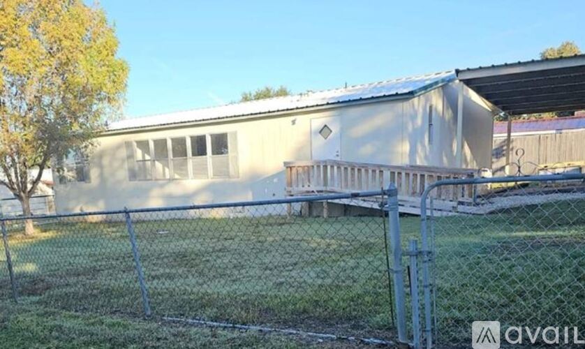 A building with a fence in front of it.