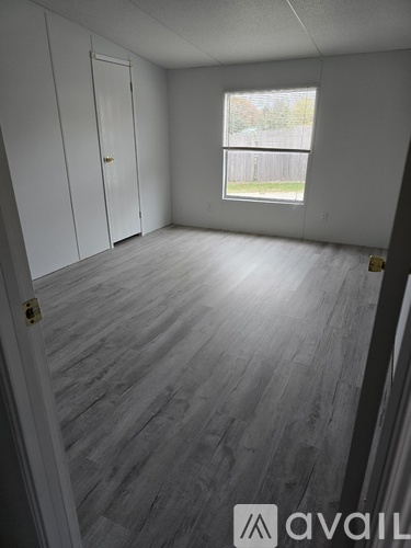 A room with Avail logo on the floor.
