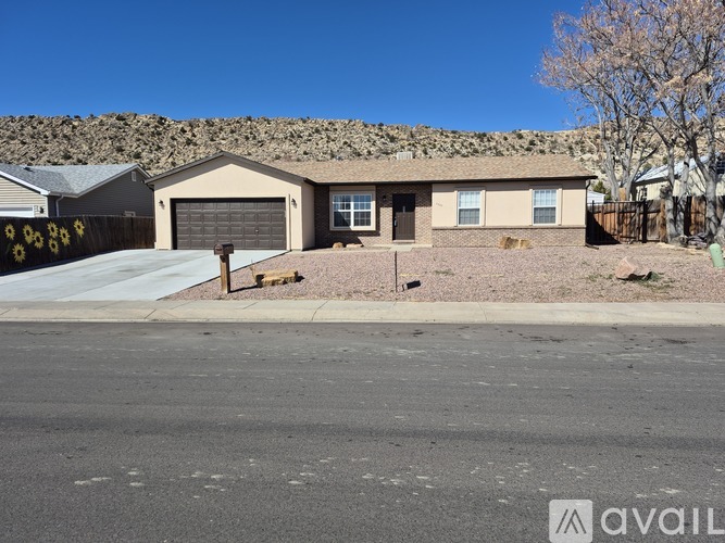 A house with a garage is available for sale.