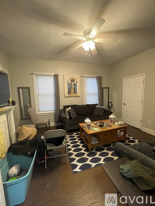 A living room with a couch, chair, and a coffee table.
