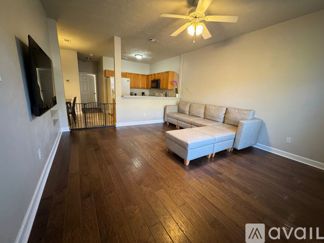A living room with a couch and a television.