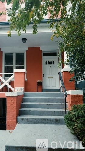 A house with a white door and a small porch.
