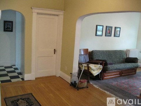 A living room with a couch and a chair.