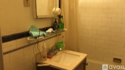 A bathroom with a sink and a mirror.