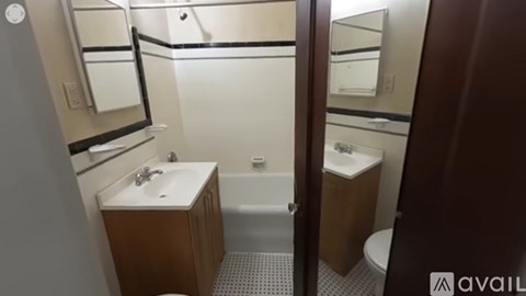 A bathroom with a sink, toilet, and bathtub.