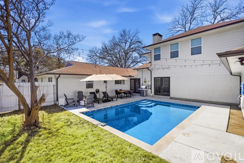 A house with a pool in the backyard.