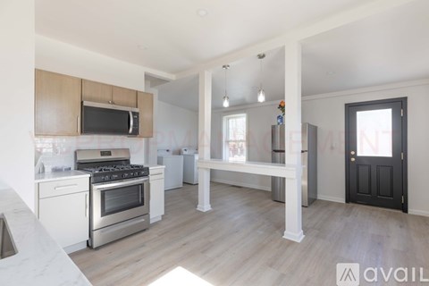 A kitchen with a stove top oven and microwave.