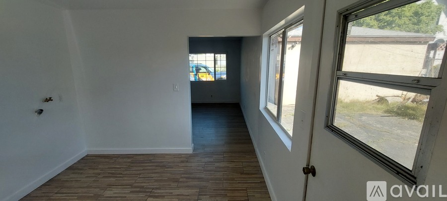 A room with a door and a window.