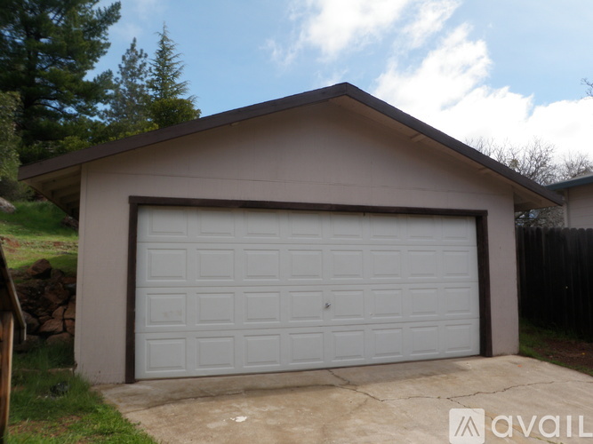 A garage with a white door is available for rent.