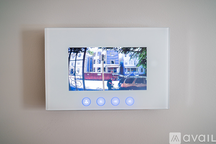 A white framed picture with a blue and white building and three blue lights on the bottom.