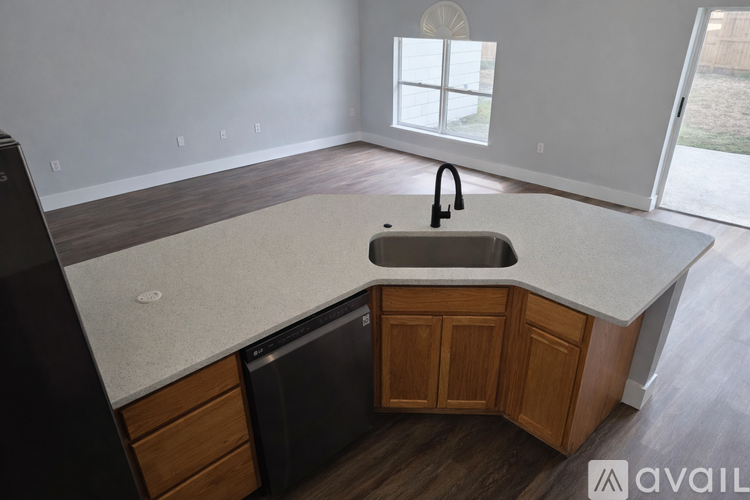 A kitchen with a sink and a dishwasher.