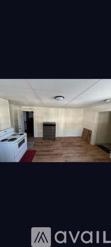 A kitchen with a refrigerator, dishwasher, and oven.