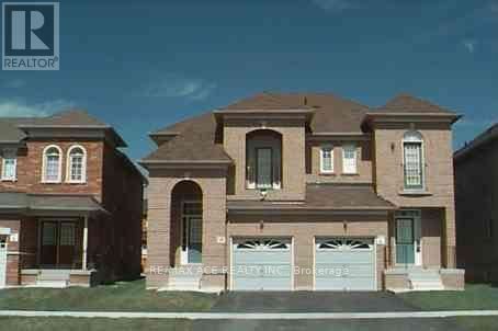 A two-story house with a garage is shown in the image.