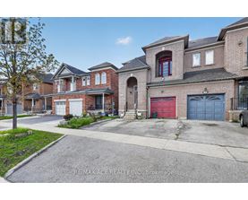 A house with a red garage door is for sale.