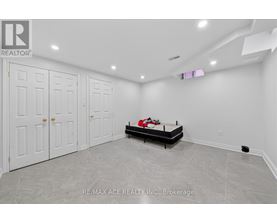 A bedroom with a bed, dresser, and wardrobe.