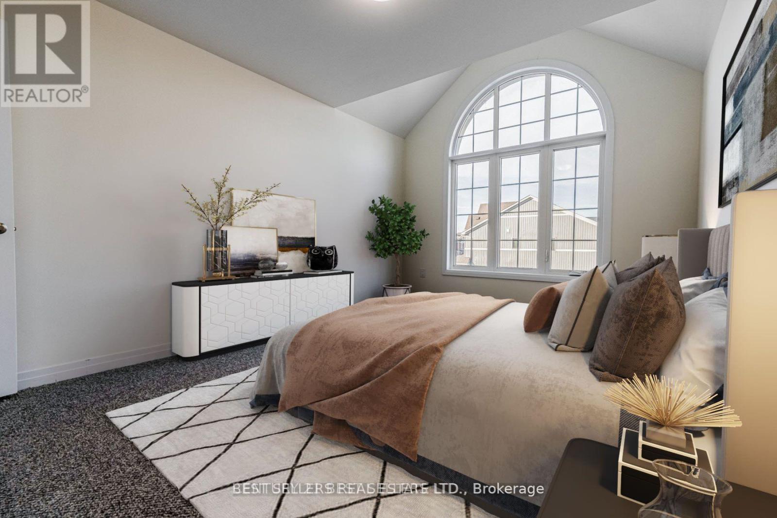 A bedroom with a large bed and a window.