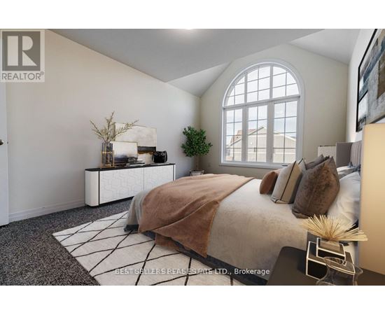 A bedroom with a large bed and a window.