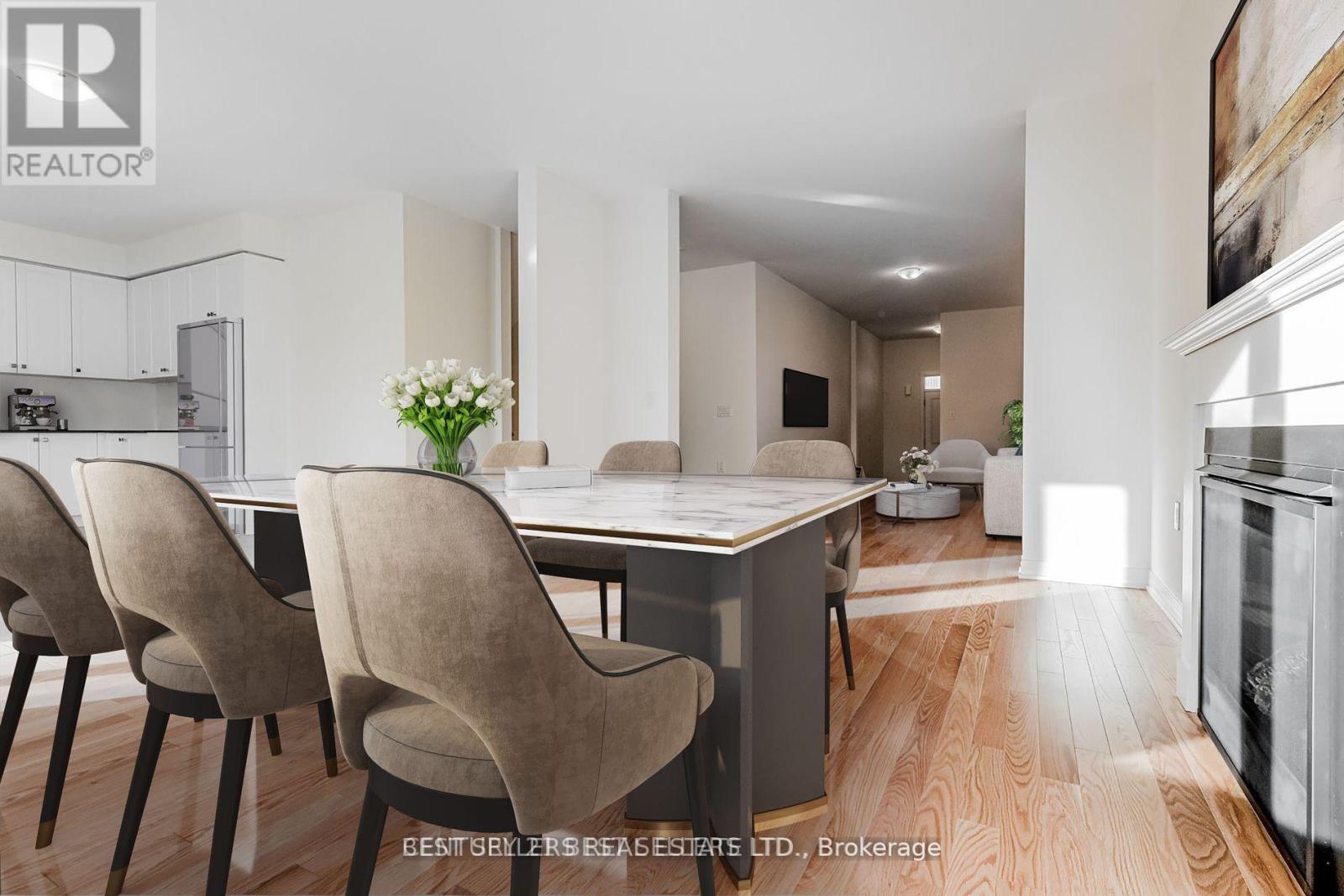 A modern kitchen with a dining table and chairs.