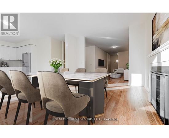 A modern kitchen with a dining table and chairs.