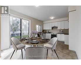 A dining area with a table set for four.
