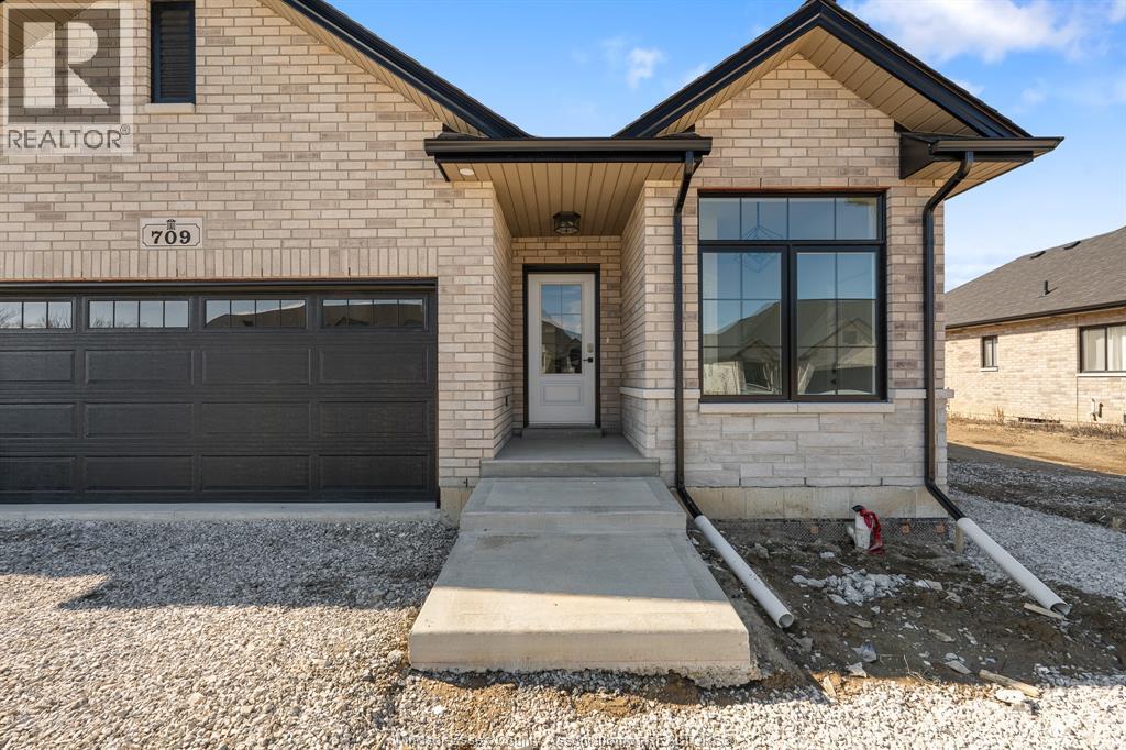 A house with a realtor sign on the front.