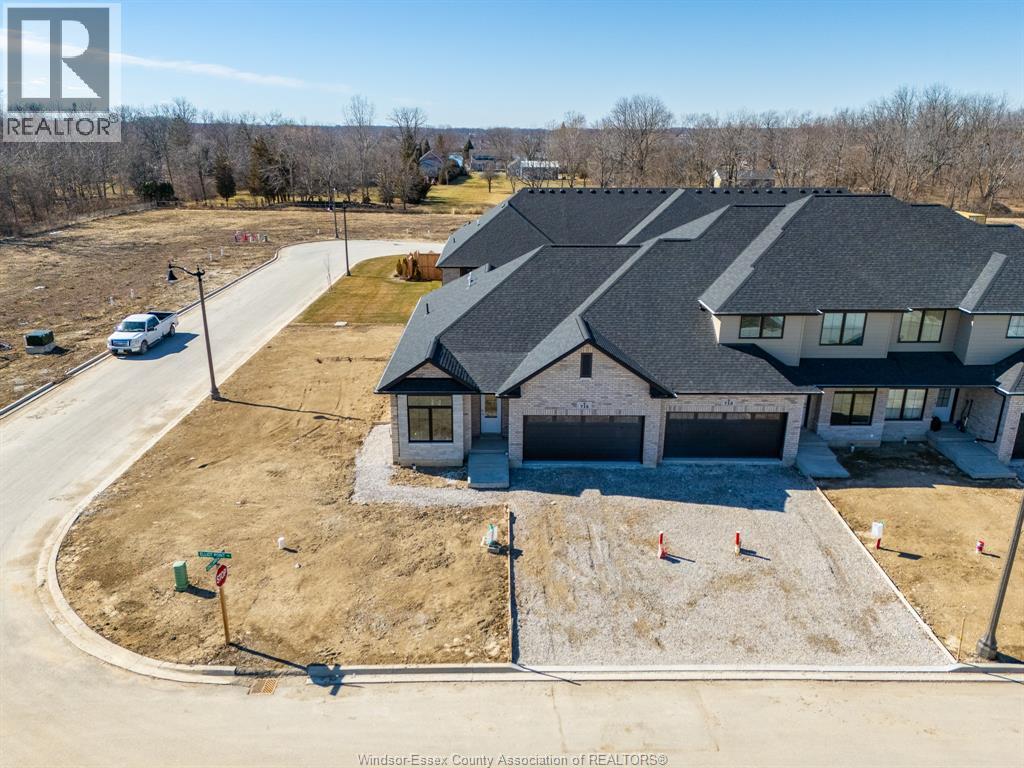 A large house with a driveway in front of it.