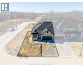 A house under construction with a REALTOR® logo on the top left.