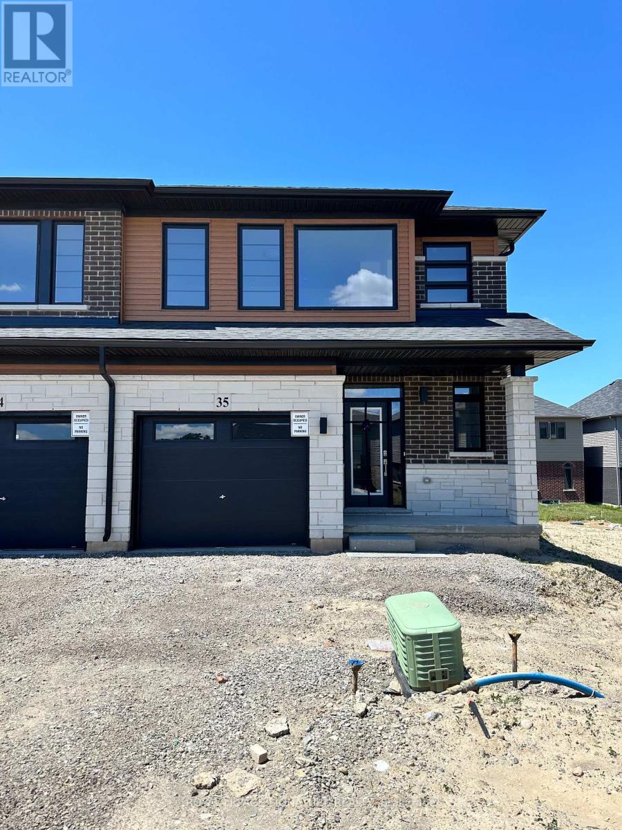 A house with a brown roof and a garage door.