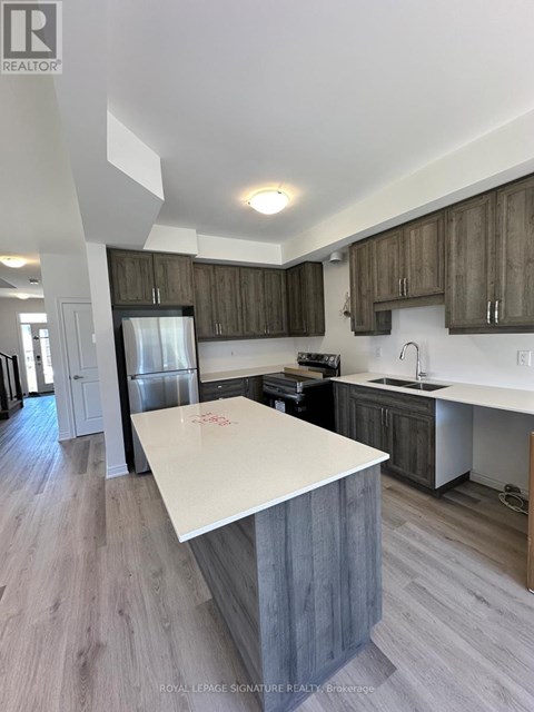A kitchen with a white counter top and wooden cabinets.